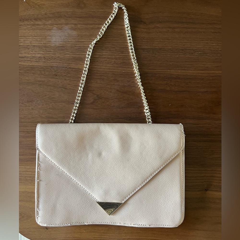 Mango clutch with hidden gold chain